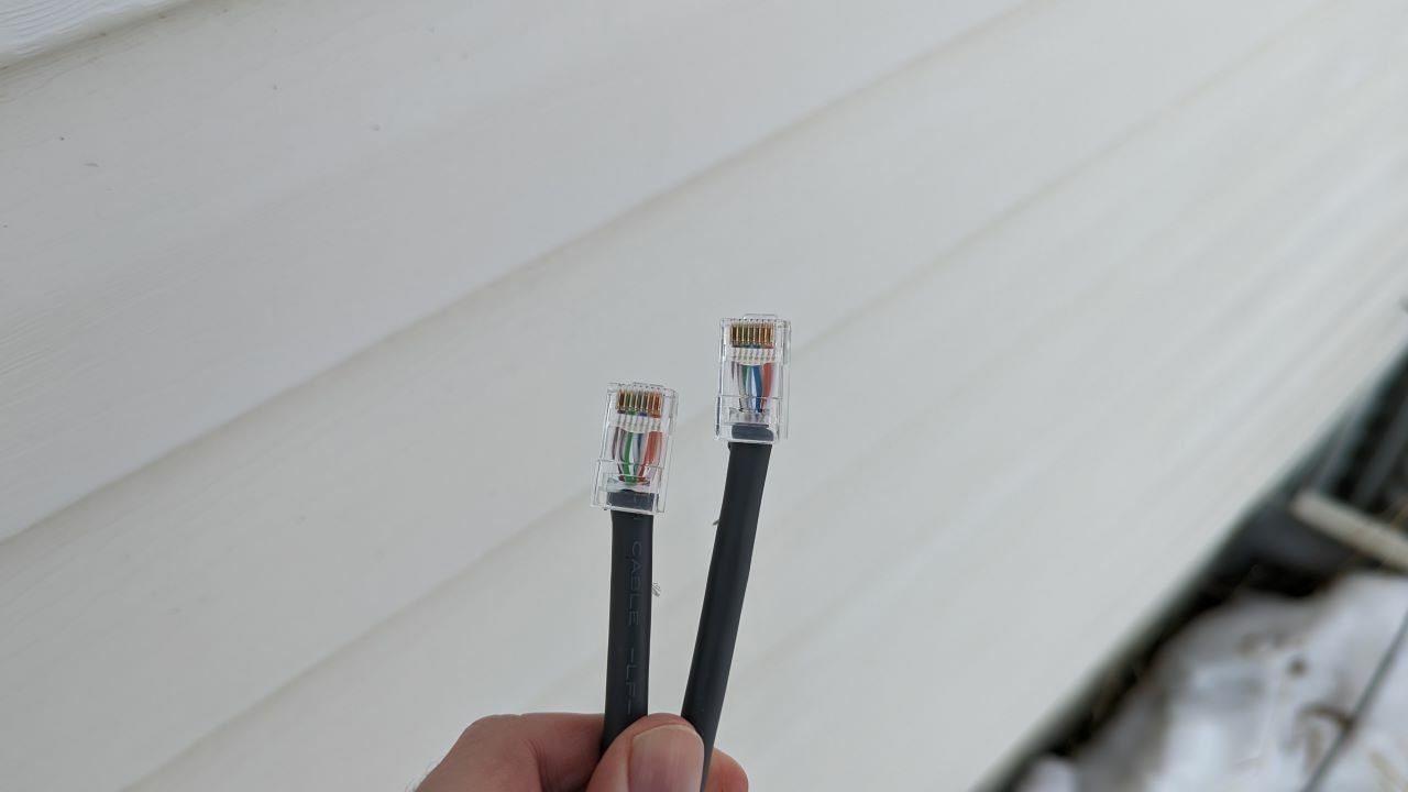 Two re-plugged ends of a Starlink cable, ready for coupling