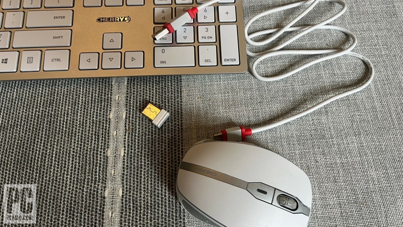 Keyboard, mouse, wireless receiver, charging cord.