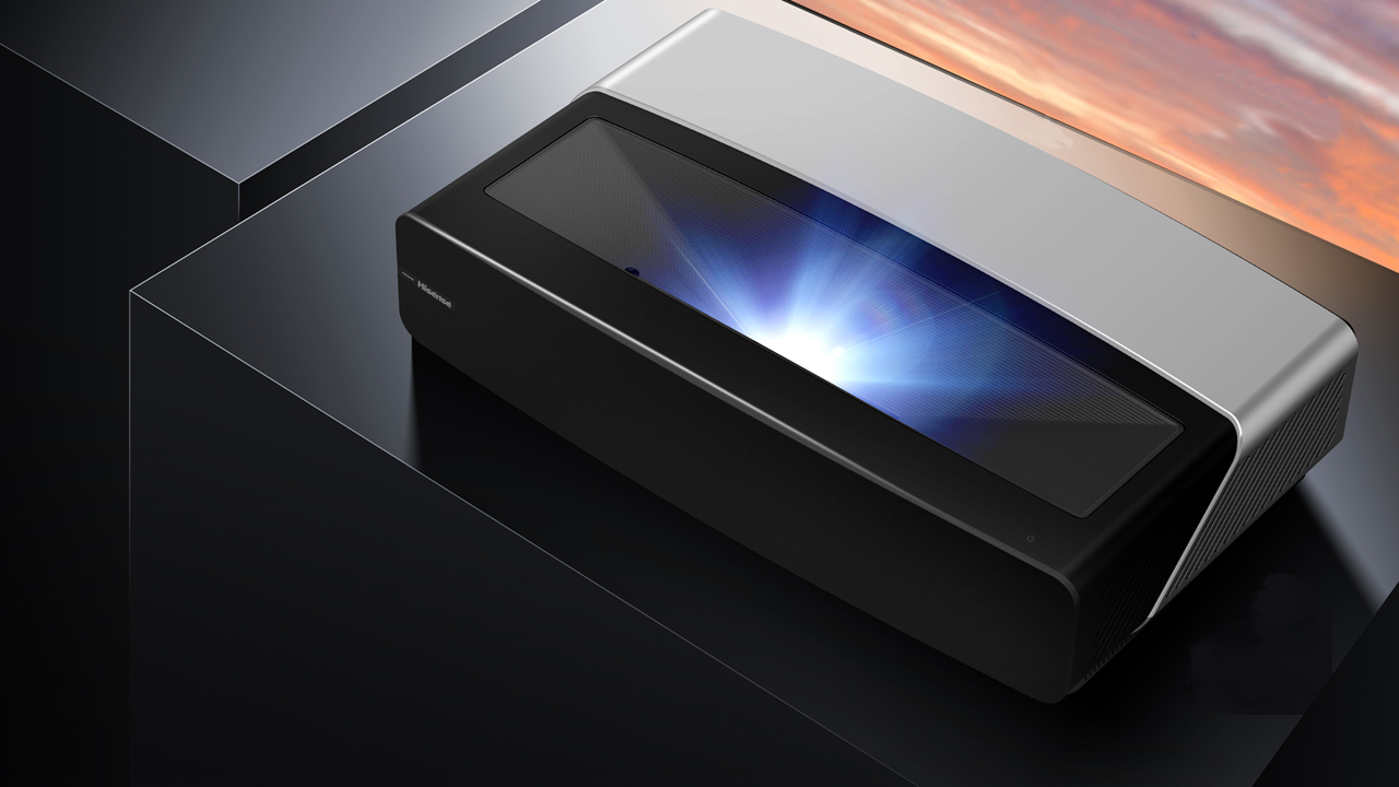 Hisense 100L5G-Cine100A projector showing the front of the projector, just 11.4 inches from the screen 