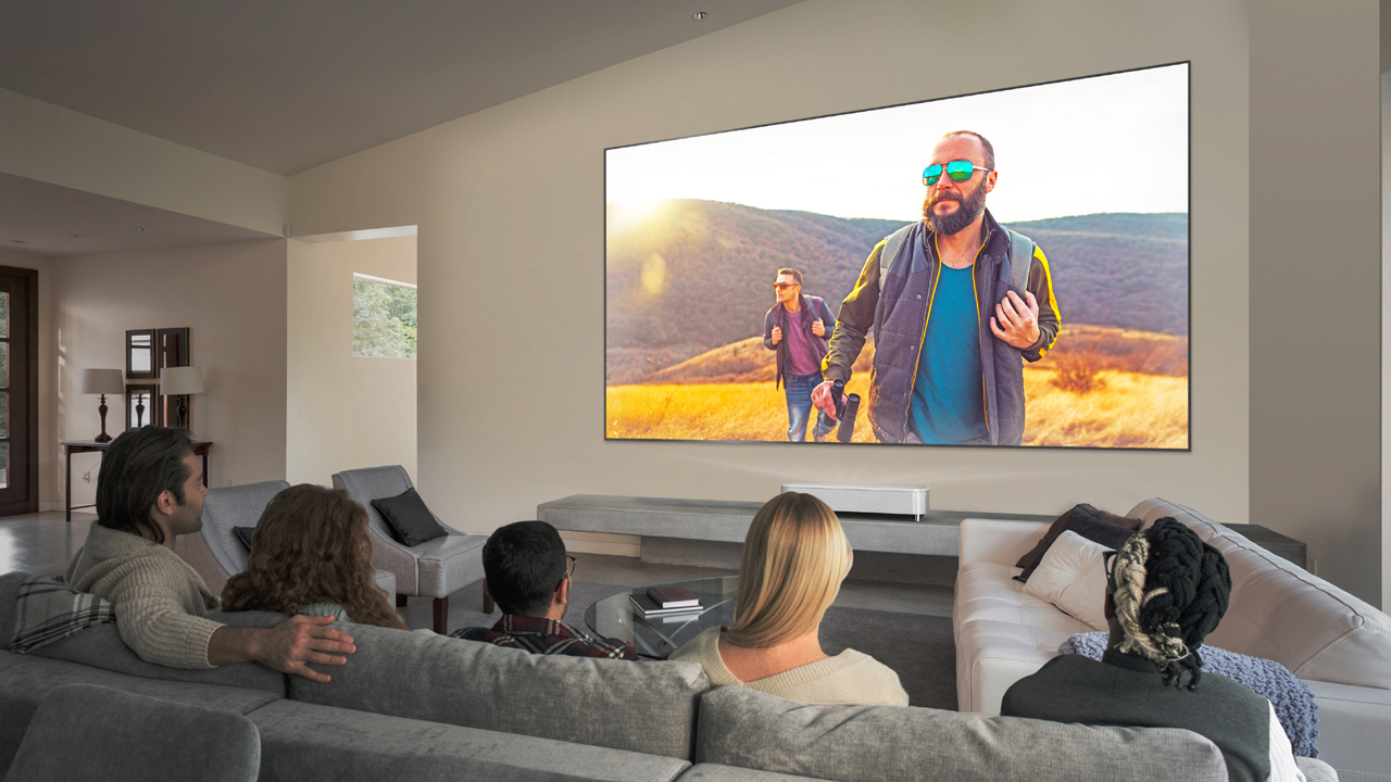 Group watching movie with lights on in room