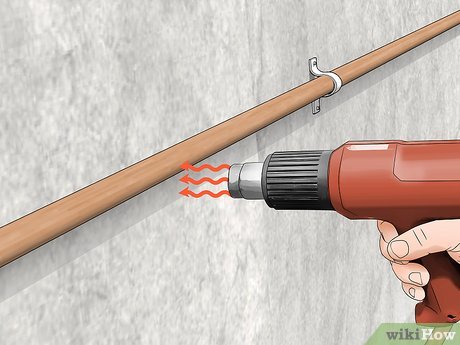 Step 4 Use a hair dryer or heat gun to slowly thaw the pipe.