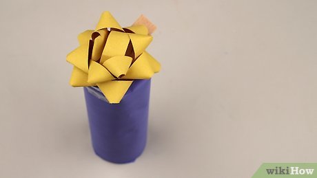 Step 8 Decorate your candle wrapping with bows or ribbons.