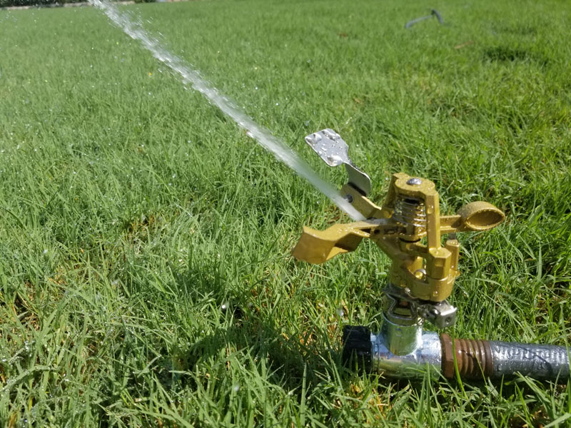 Melnor pulsating sprinkler in use