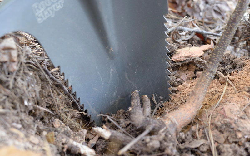 Radius Root Slayer Shovel cutting through fiberous roots