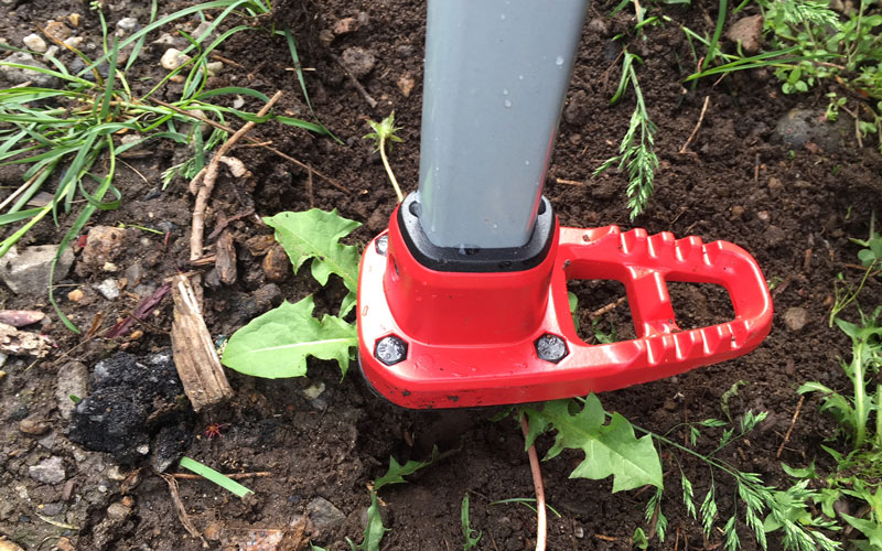 WeedSLAYER-blades-fully-inserted-into-the-soil-around-the-weed