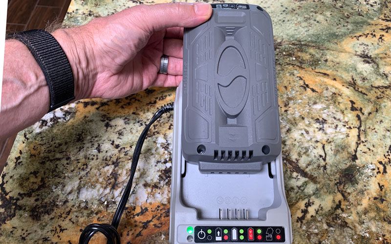 Sun-Joe-Cordless-Pressure-Washer-installing-battery-into-charger